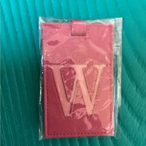 Luggage tag with monogram W.